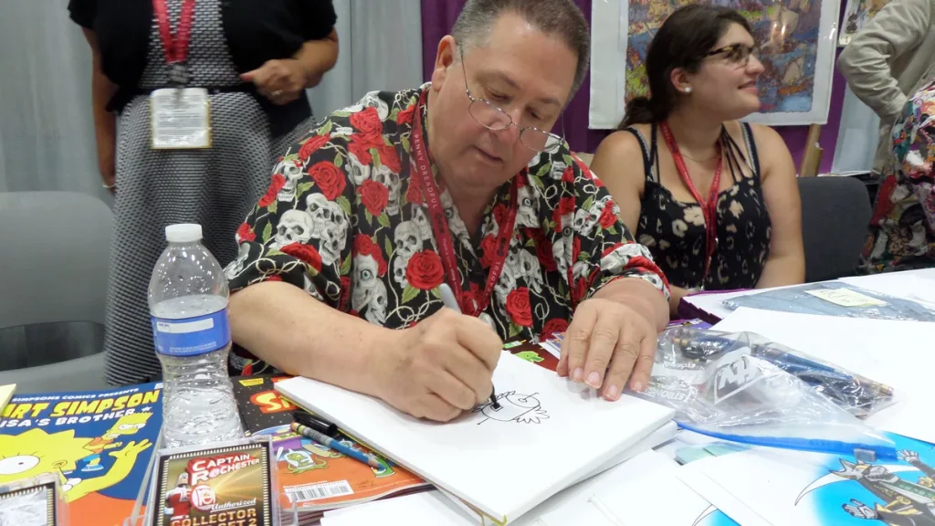 Illustrative - a comic book artist drawing at San Diego Comic-Con in 2014. The artist shown is not connected to the article.