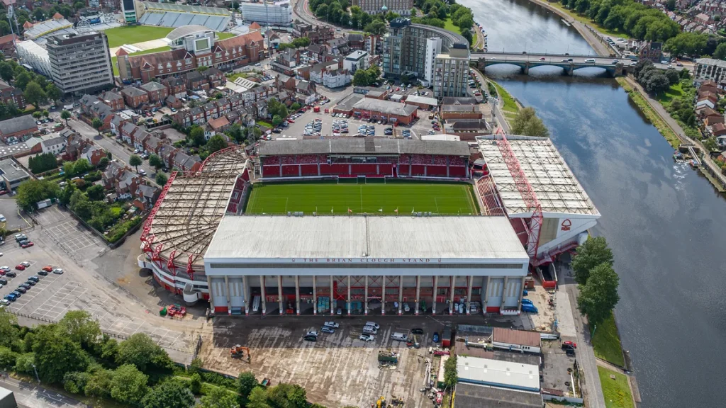 Nottingham Forest's City Ground seen from the air, with the River Trent and Trent Bridge alongside.