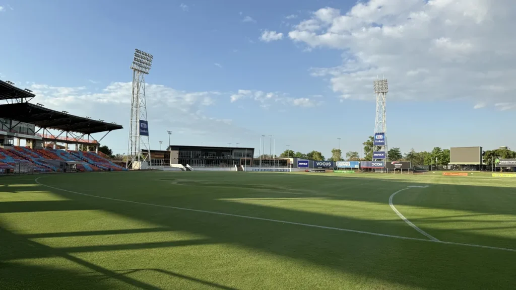 An empty TIO Stadium in Darwin, with the field, grandstands and floodlights in view.