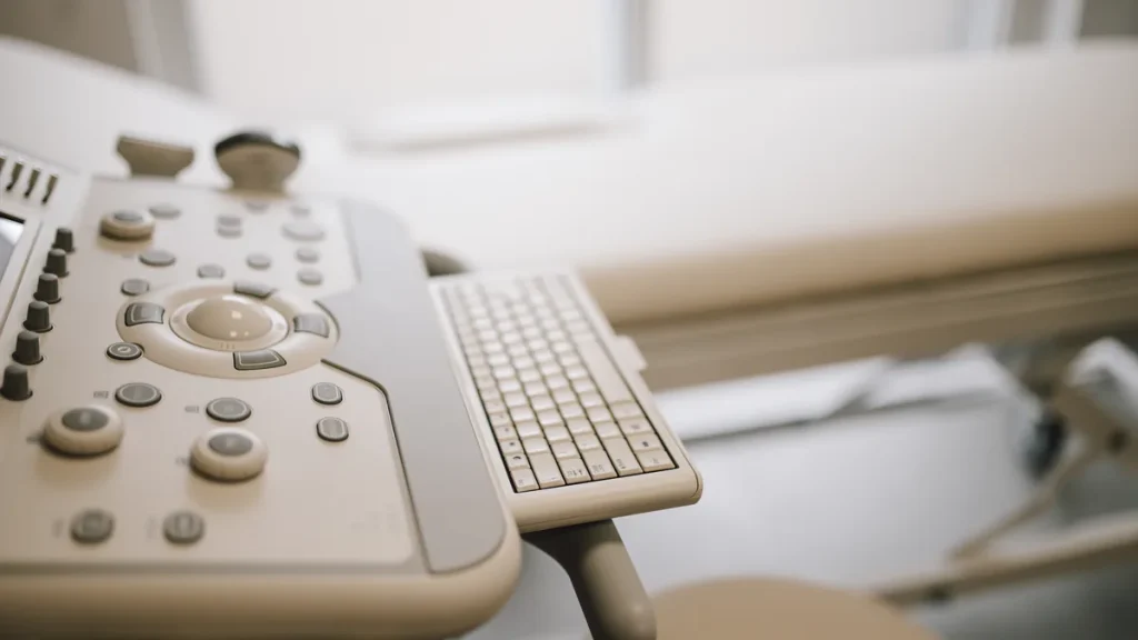 Illustrative: an ultrasound console in a medical examination room. The photograph does not show any clinic, procedure or person described in the article.
