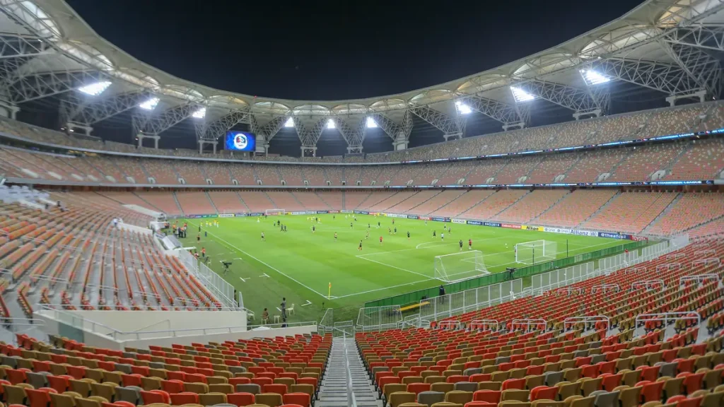 King Abdullah Sports City stadium in Jeddah, Saudi Arabia, floodlit before a football match